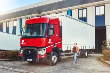 Woman walking alongside the Renault Trucks P Road