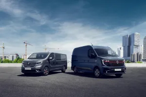 Renault Trucks Red Edition Exclusive range - Renault Trucks Trafic and Renault Trucks Master in front of a construction site backdrop on one side and a city backdrop on the other.