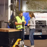 Man and woman talking in fonr tof Renault Trucks E-Tech D