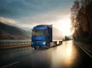 Renault Trucks E-Tech T 780 driving along a road beside a river